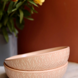 Blush pink carved salad bowls with flower vase