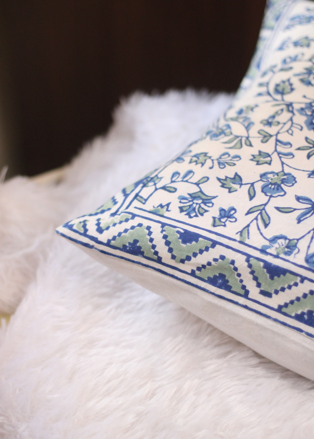 Blue floral cushion cover closeup shot
