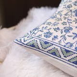Blue floral cushion cover closeup shot