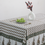 Green & brown floral table cloth with vase & fruits