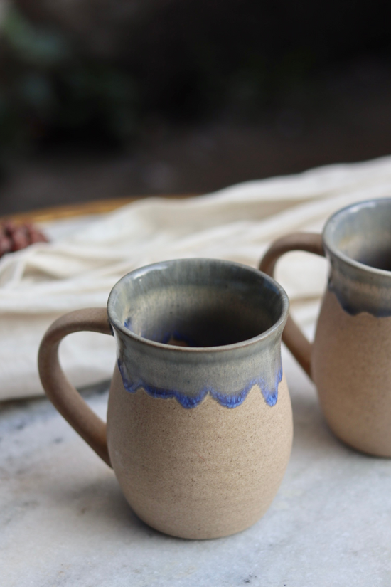 Brown and blue drip coffee mug tall
