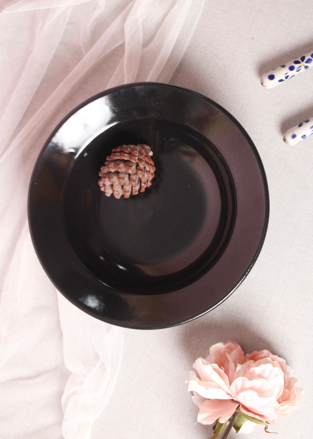 Black pasta plate with a flower
