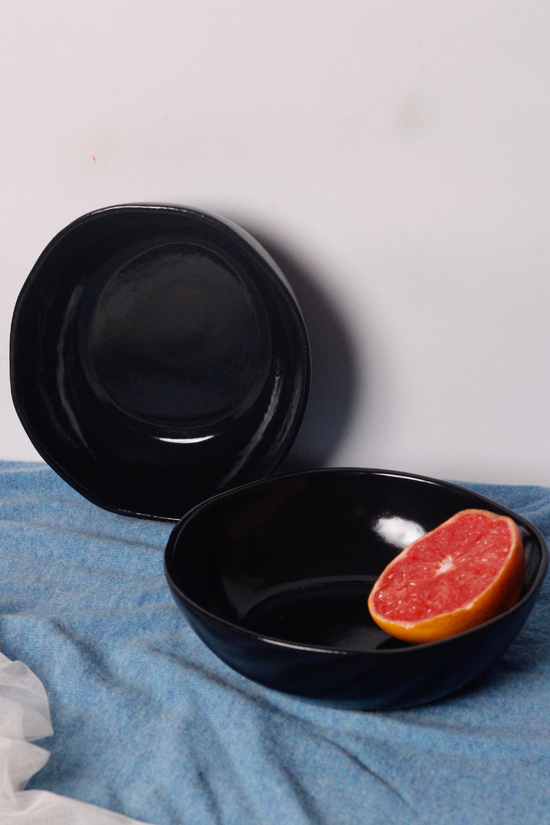 Glossy black curry bowls with orange 