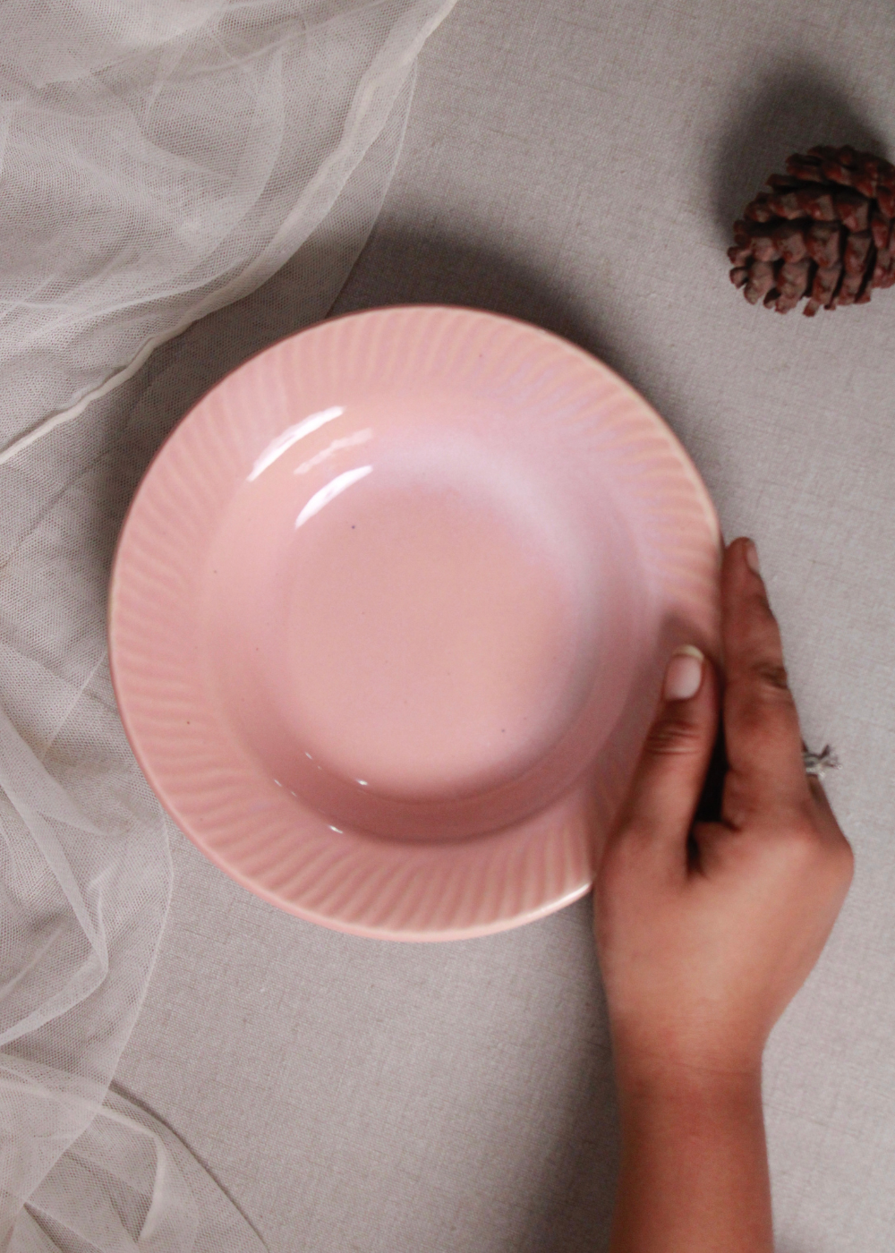Blush pink snack bowl in hand