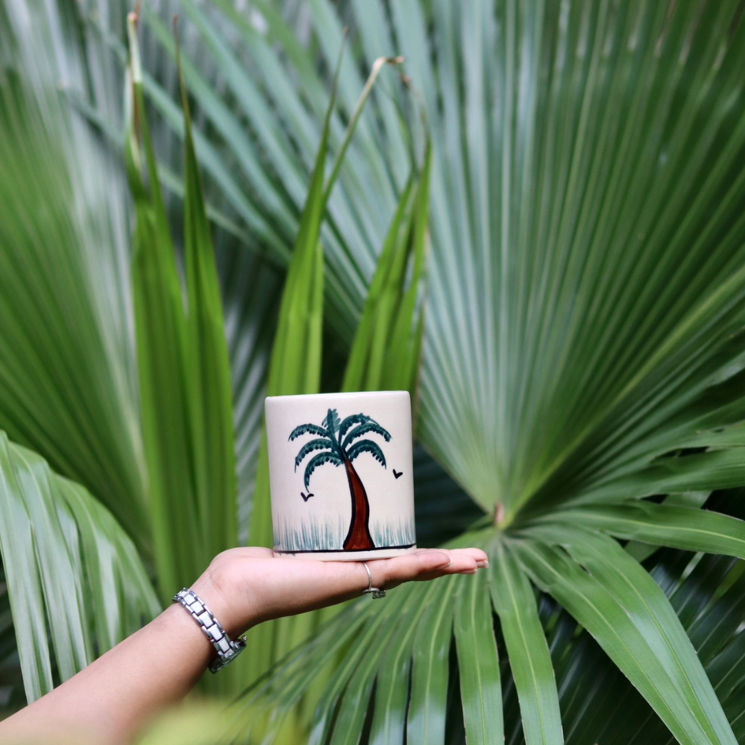 Palm tree brush holder in hand 
