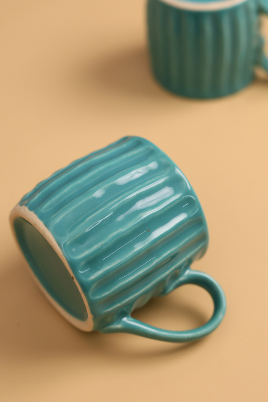 Handmade ceramic teal tea cup