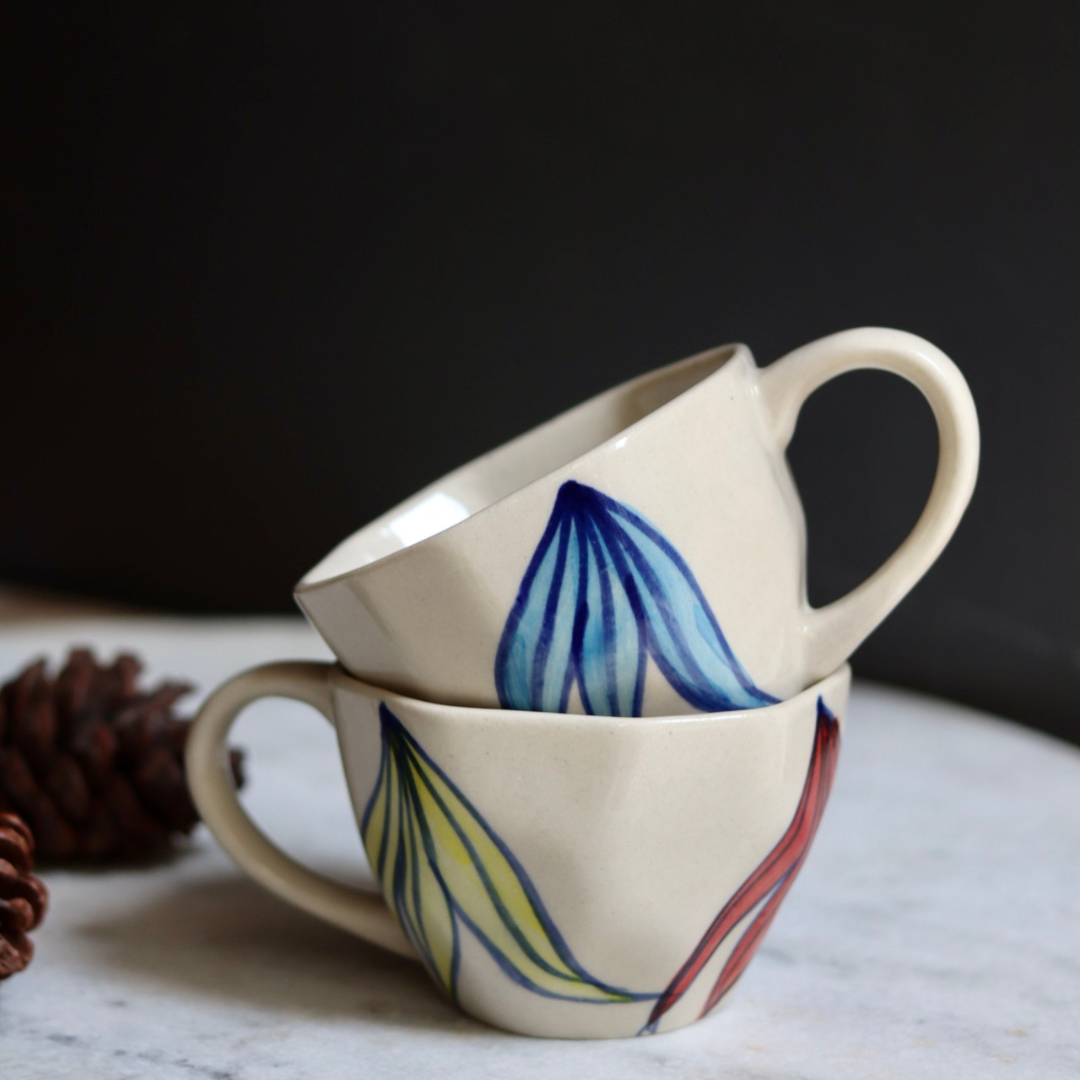 Two handmade ceramic petal coffee mugs