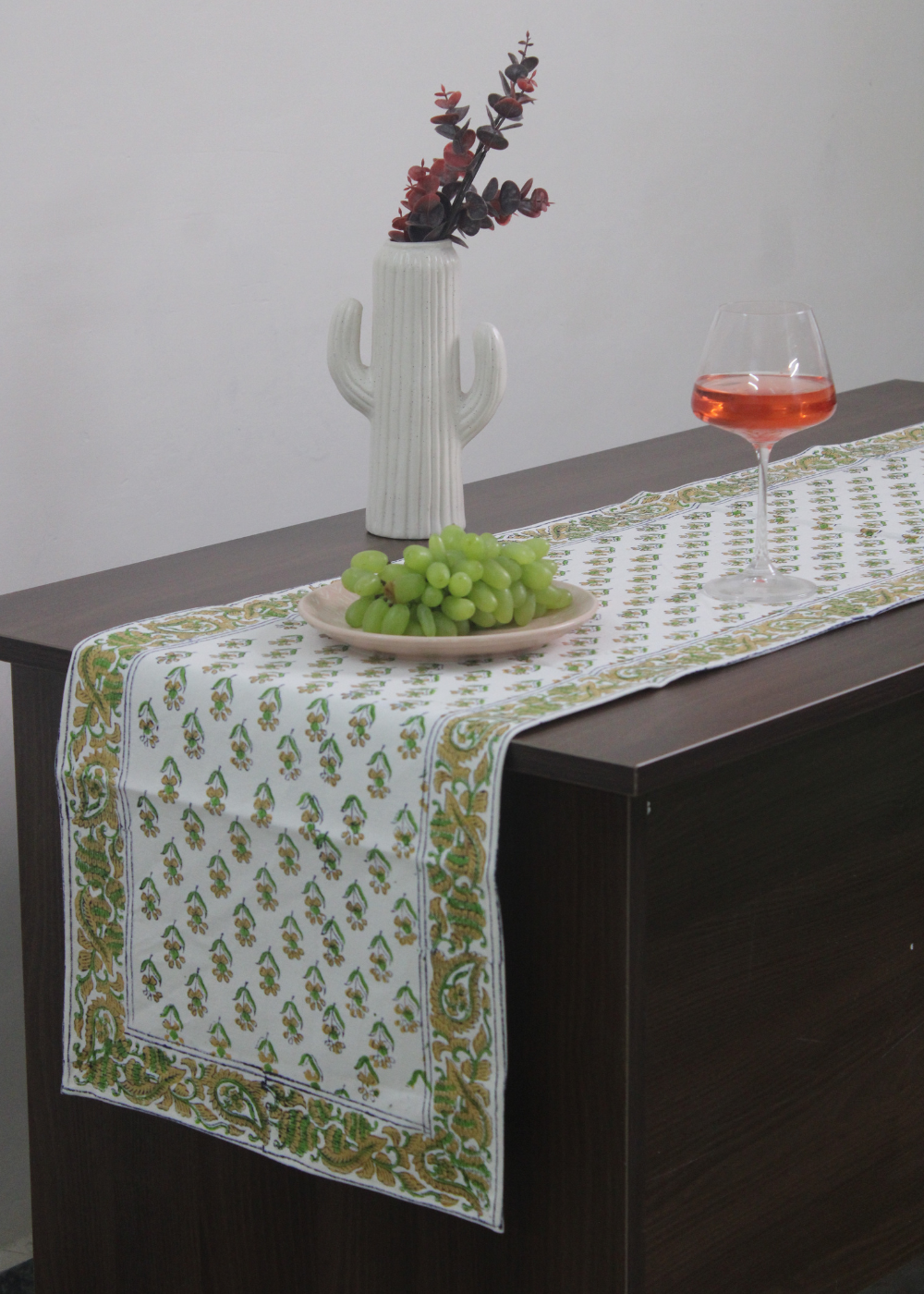 Green motif table runner with fruits