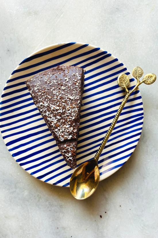 Leaf brass spoon in plate 