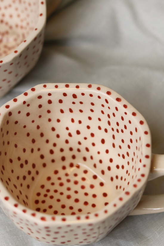 Top shot of red polka mugs