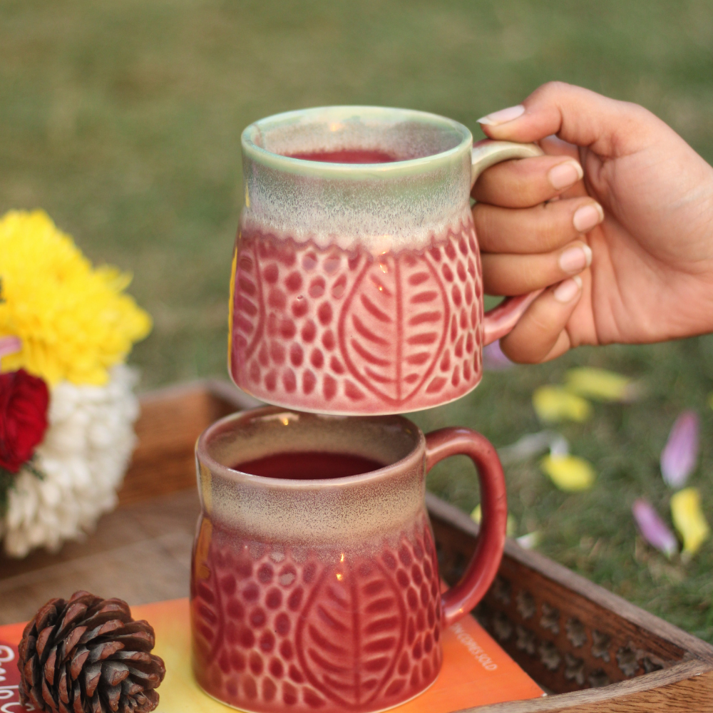 Ceramic coffee mug in hand 