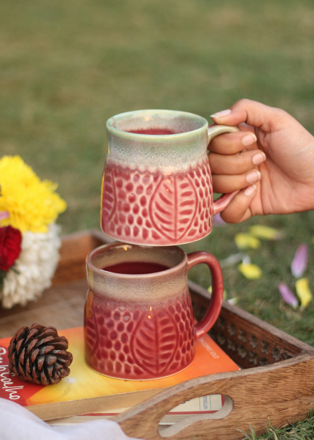 Ceramic coffee mug in hand 