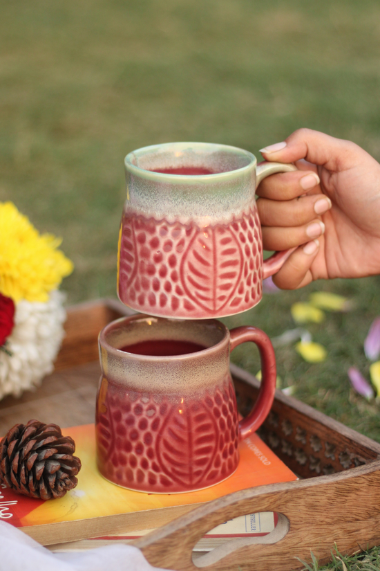 Ceramic coffee mug in hand 