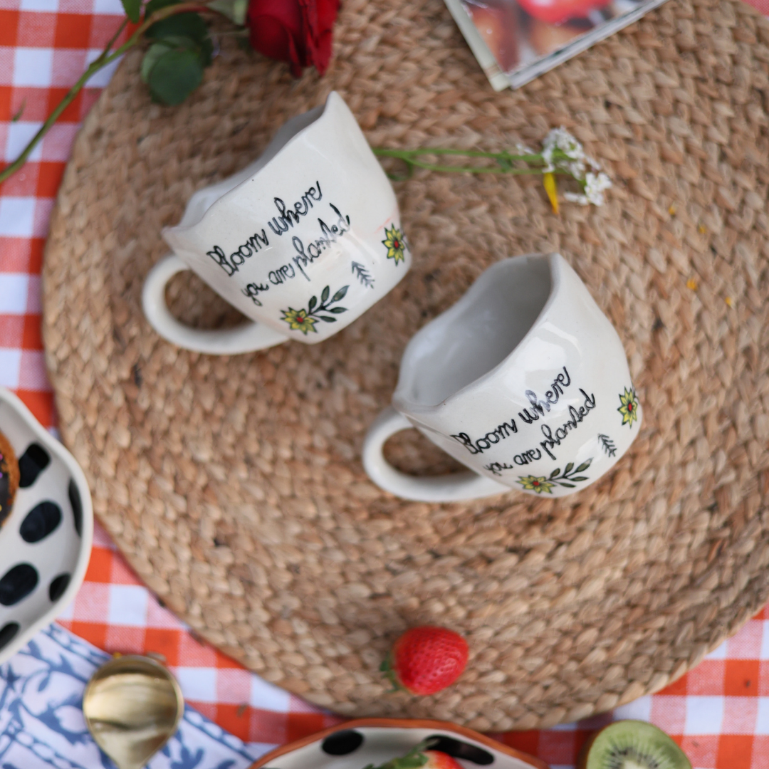 Three coffee mugs on a mat