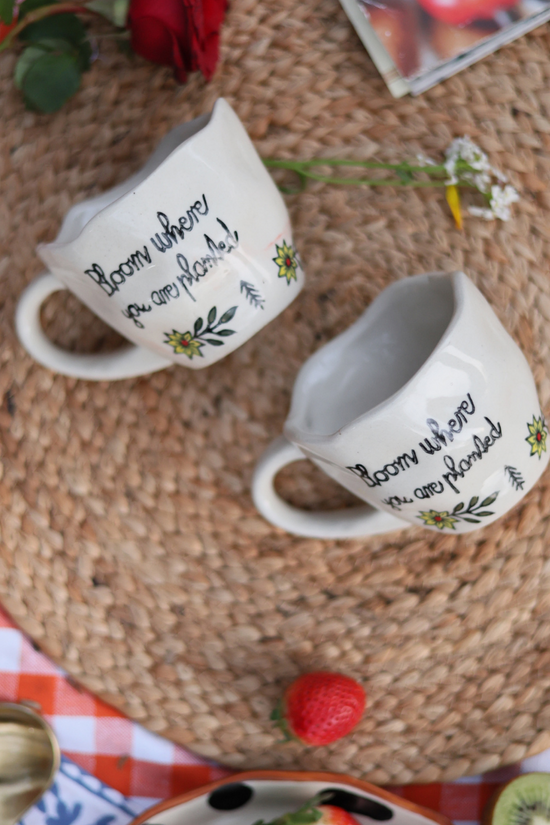 Three coffee mugs on a mat