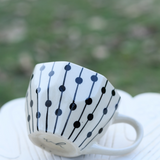 Black dotted coffee mug