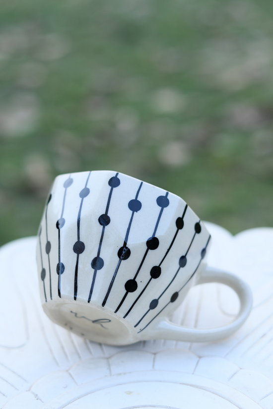 Black dotted coffee mug
