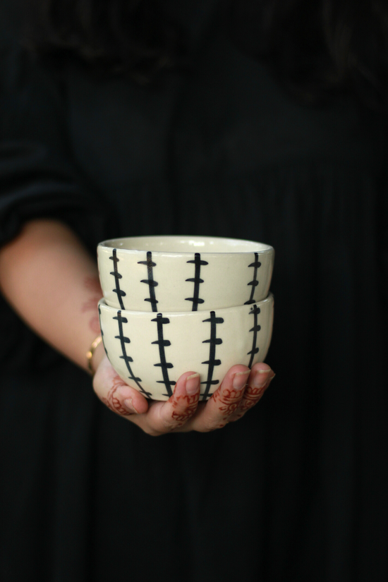Crosses soup bowl in hand