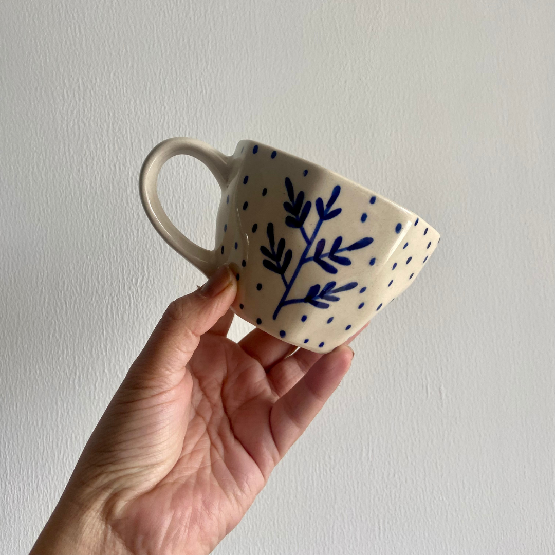 Blue leaf mug in hand