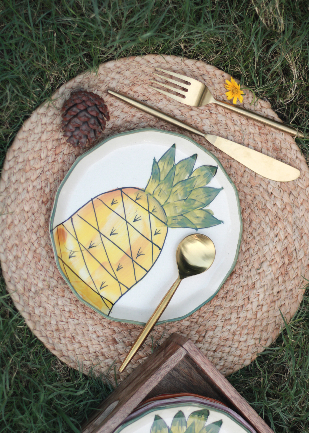 Ceramic pineapple plate on mat 
