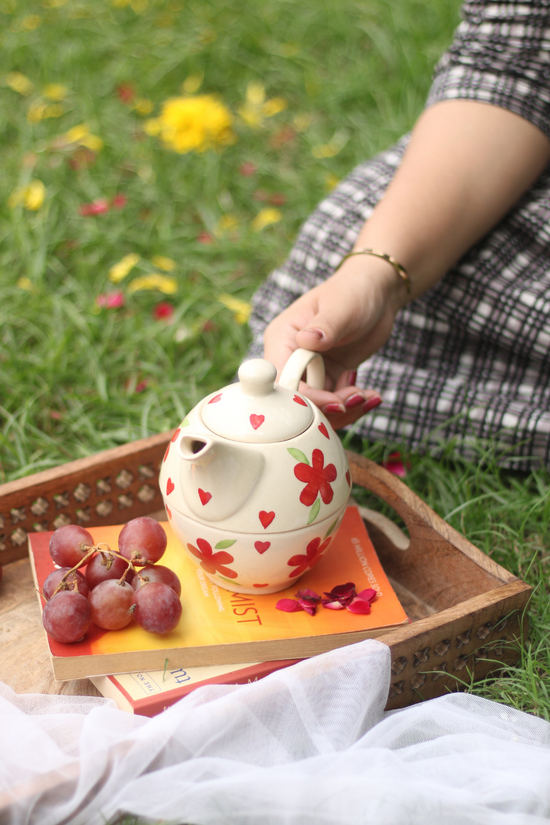 Ceramic tea set in hand 