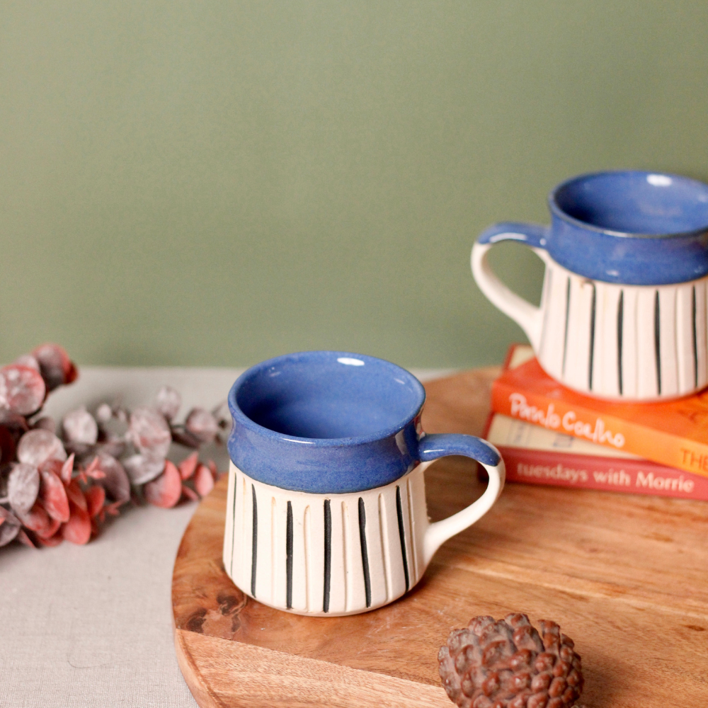 Glossy & matte blue mug on wooden surface