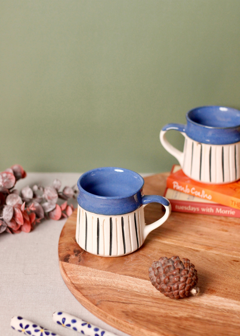 Glossy & matte blue mug on wooden surface