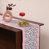 Blue and pink floral table runner with flower vase