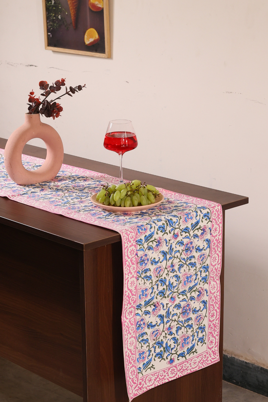 Blue and pink floral table runner with flower vase
