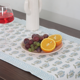 Blue palm trees block print table runner on table