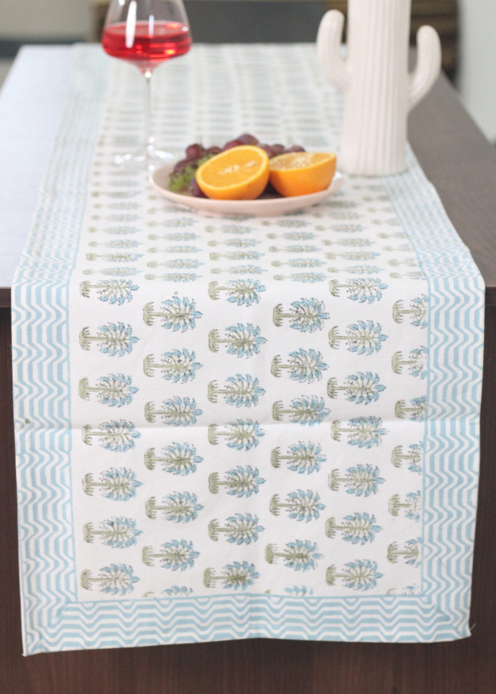 Blue palm trees block print table runner on table
