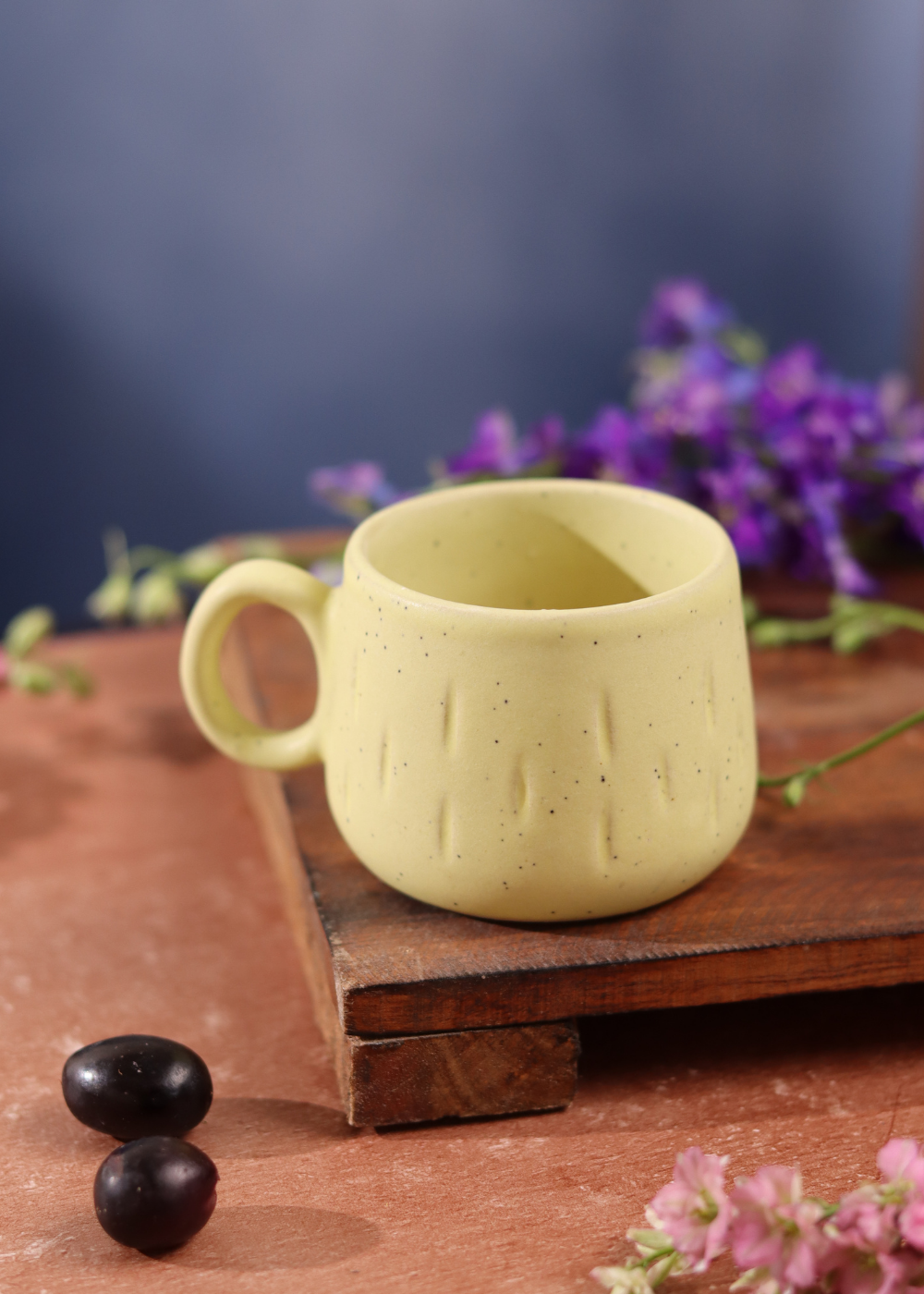 Mellow yellow chai cup on wooden surface