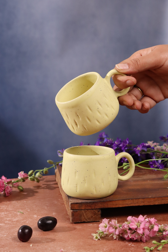 Two mellow yellow coffee mug