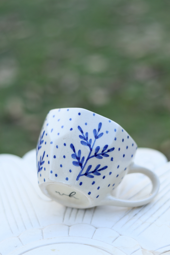 Blue fall leaf coffee mug on surface