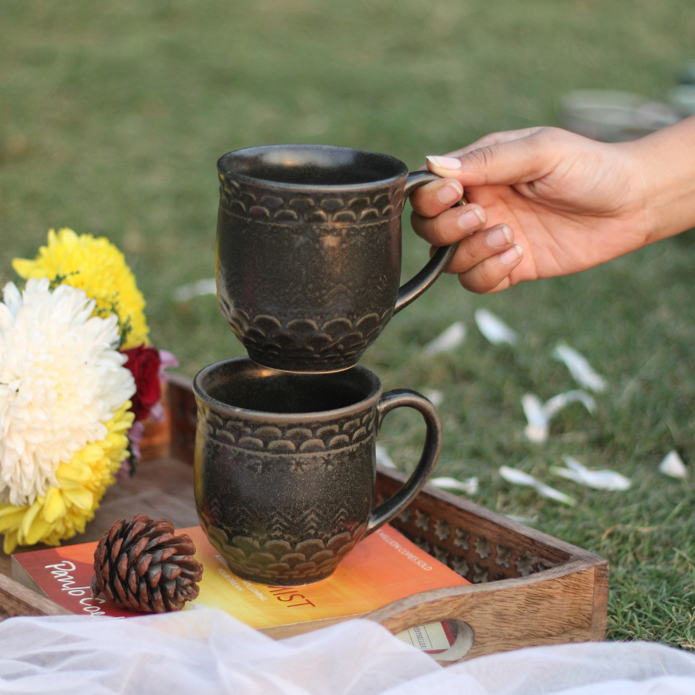 Two black ceramic handmade mugs