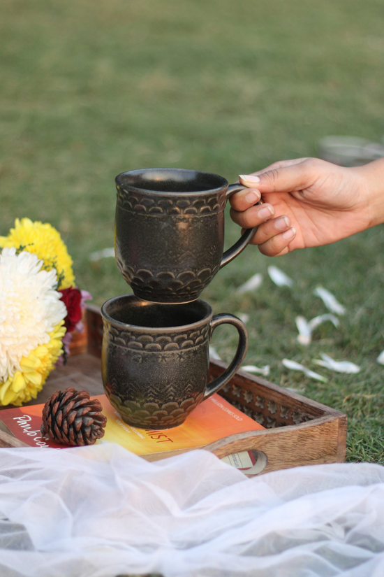 Two black ceramic handmade mugs