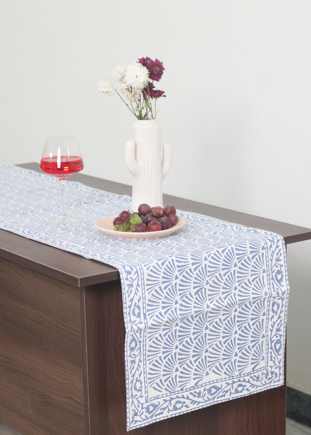 Blue chevron table runner with vase 