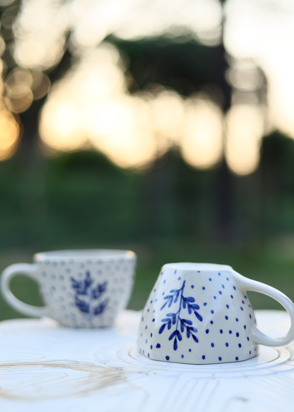 Two white coffee mug different position 