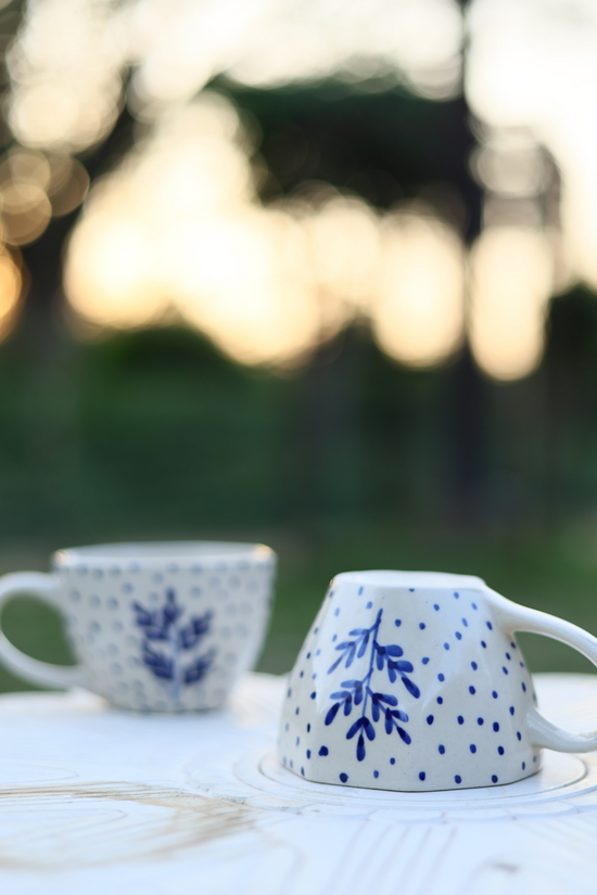 Two white coffee mug different position 