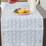 Blue chevron table runner with fruits & vase on it
