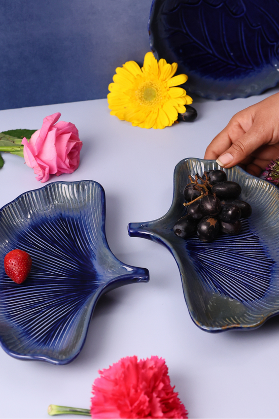 Handmade ceramic platter in hand