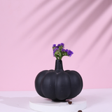Black pumpkin bud vase with lavender flower