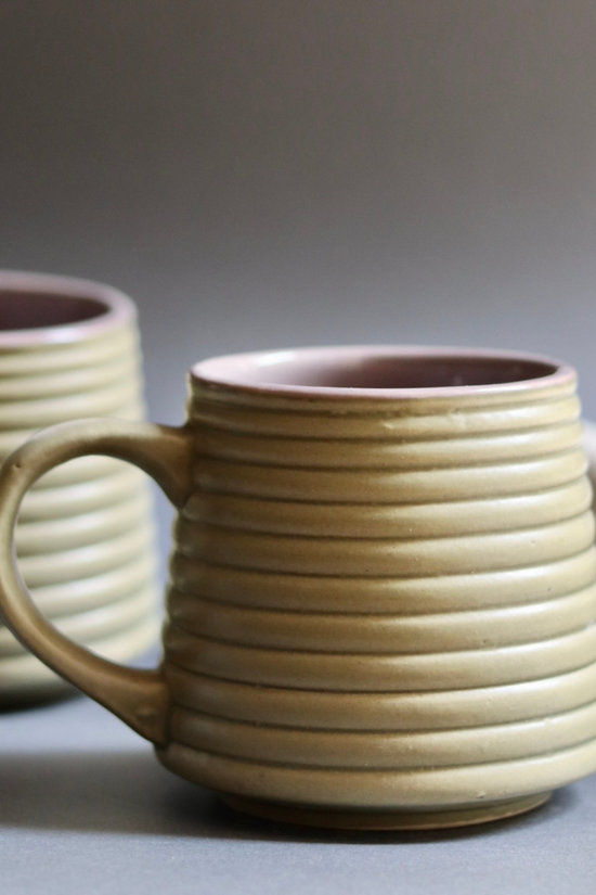 Two army green and grey coffee mugs
