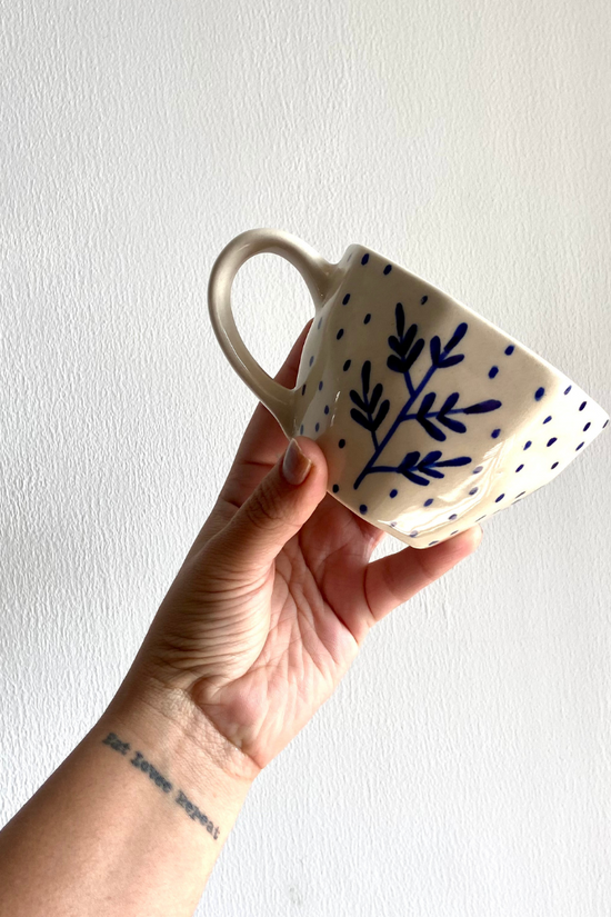 Blue fall leaf coffee mug in hand