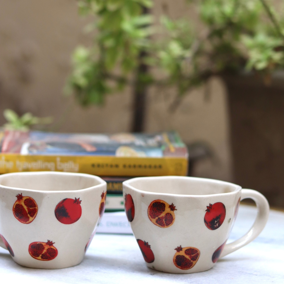 Two anar print red & white coffee mugs 