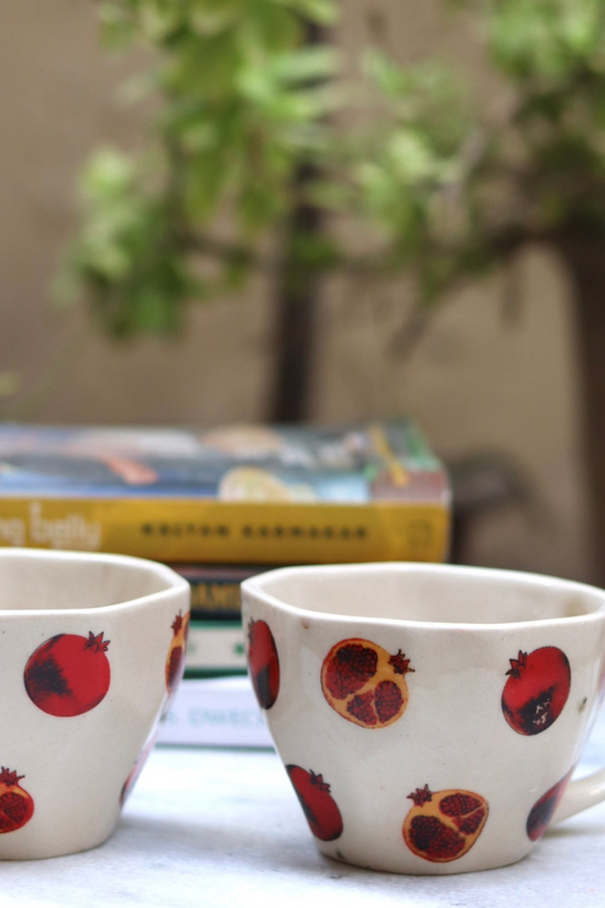 Two anar print red & white coffee mugs 