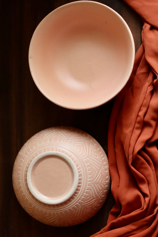 Blush pink carved curry bowl with red cloth