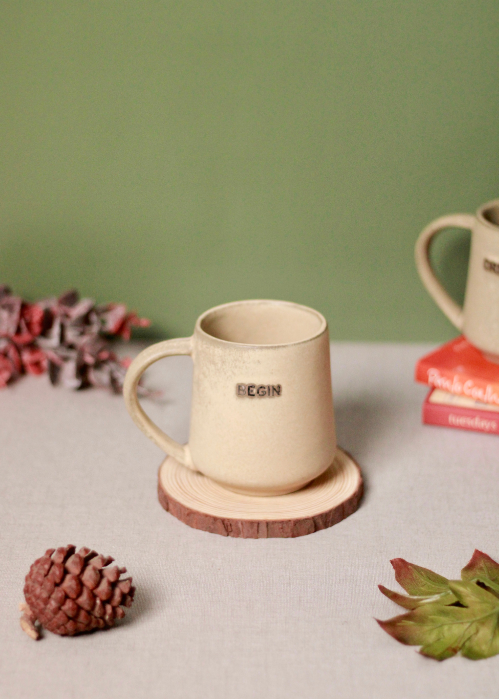 Begin coffee mug on a wooden coaster