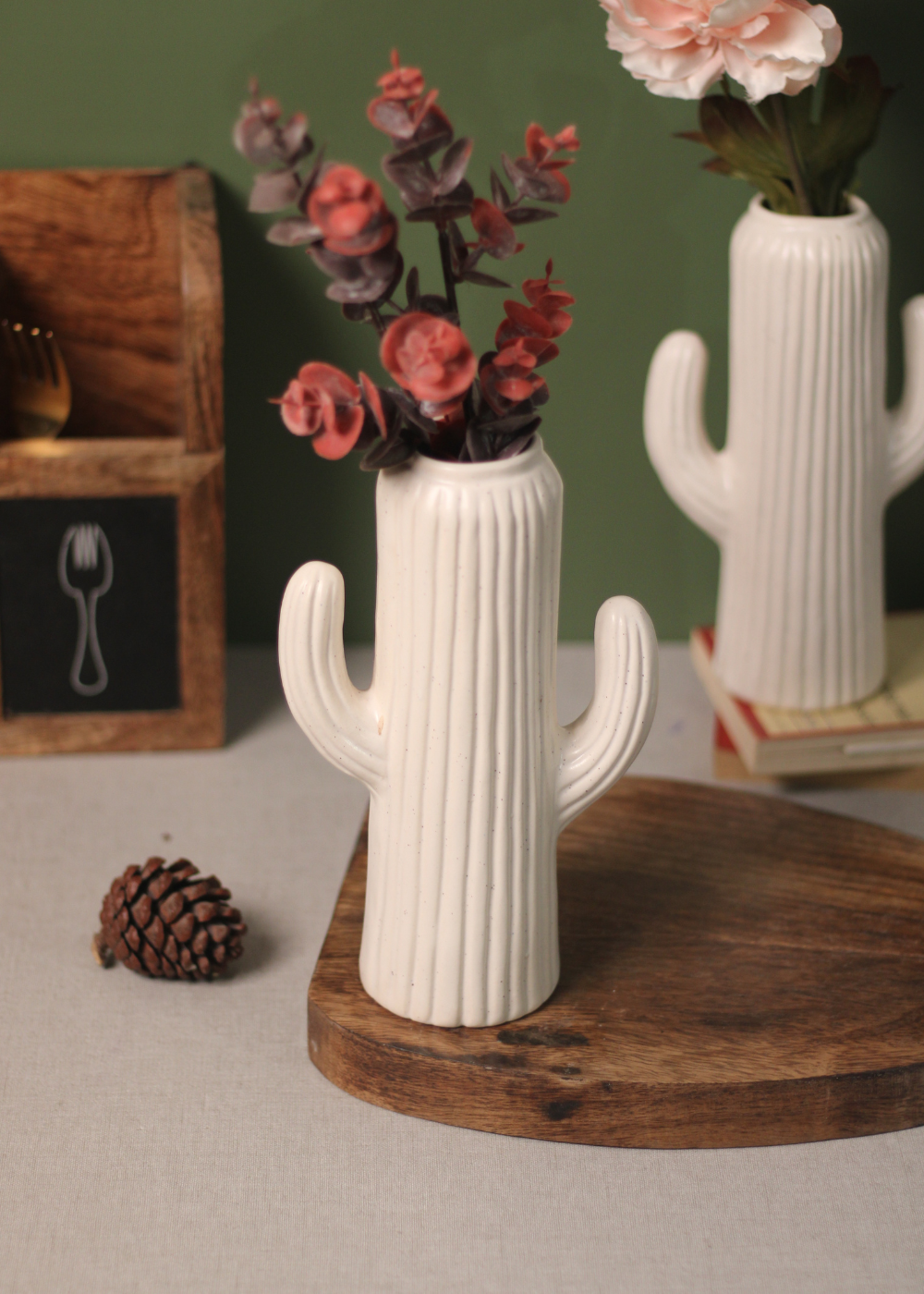 Decorative handmade ceramic white flower vase with flowers