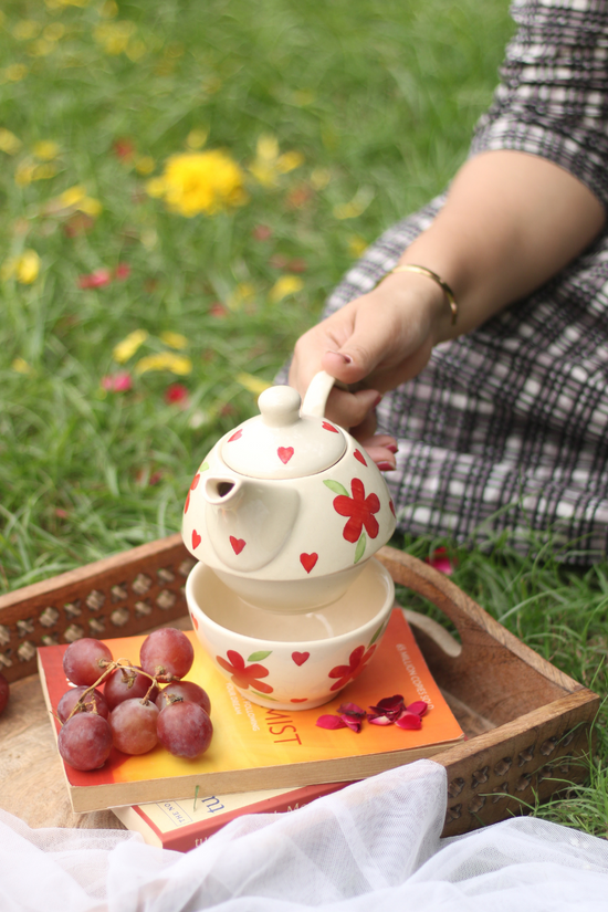 Red florals tea set in garden 